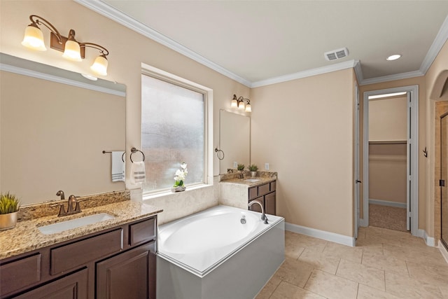 28647 Maple Red Dr, Katy, TX 77494 - full bath with two vanities, crown molding, a bath, a stall shower, and a walk in closet