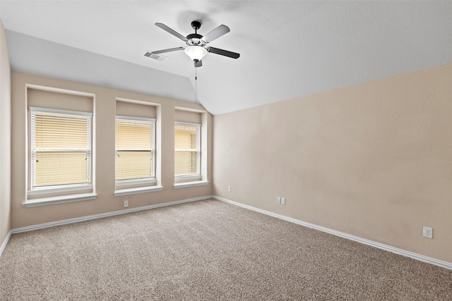 28647 Maple Red Dr, Katy, TX 77494 - empty room featuring vaulted ceiling, carpet flooring, and a ceiling fan