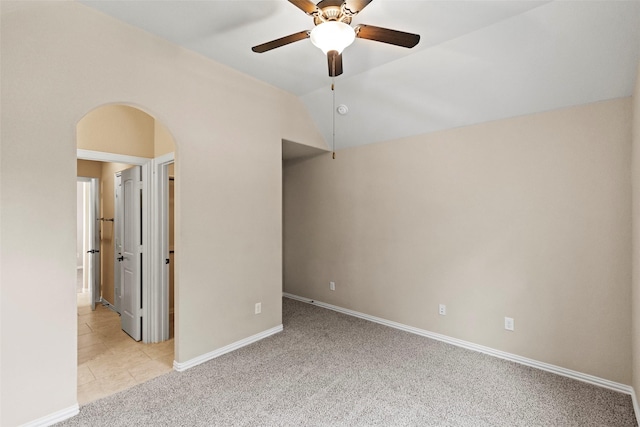 28647 Maple Red Dr, Katy, TX 77494 - unfurnished bedroom with arched walkways, carpet, a ceiling fan, and ensuite bath