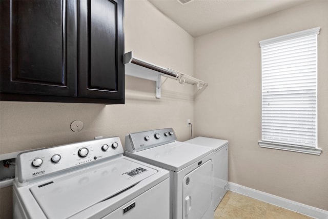 28647 Maple Red Dr, Katy, TX 77494 - laundry room with washing machine and clothes dryer and cabinet space