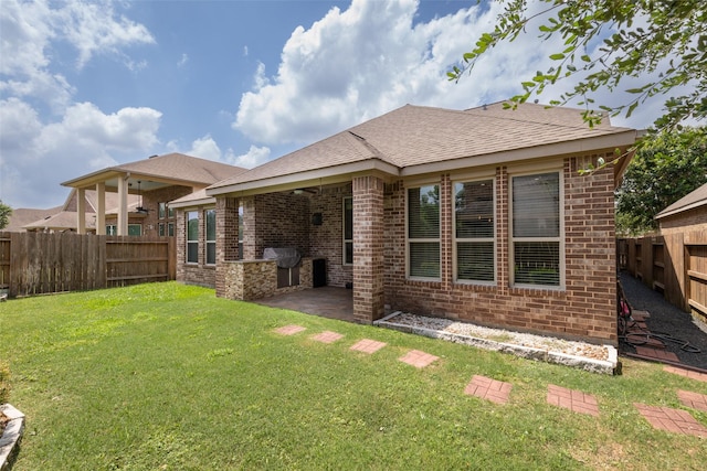 28647 Maple Red Dr, Katy, TX 77494 - back of property with brick siding, a fenced backyard, and a patio area