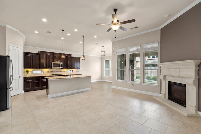 28647 Maple Red Dr, Katy, TX 77494 - kitchen with stainless steel appliances, open floor plan, ceiling fan, crown molding, and light countertops