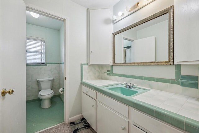 2415 W T C Jester Blvd, Houston, TX 77008 - bathroom featuring vanity and tile walls