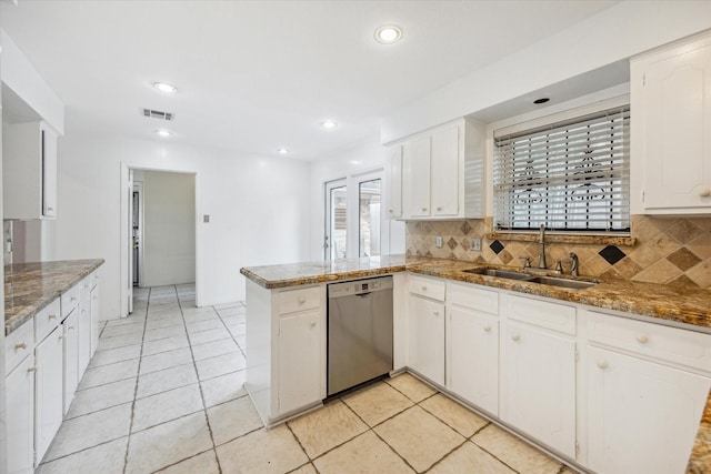 2415 W T C Jester Blvd, Houston, TX 77008 - kitchen featuring stainless steel dishwasher, a peninsula, decorative backsplash, white cabinetry, and recessed lighting