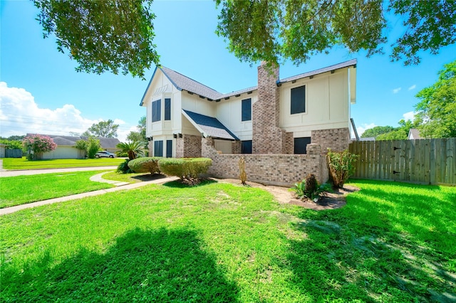 21434 Park Bluff Dr, Katy, TX 77450 - view of front of property featuring brick siding and a chimney
