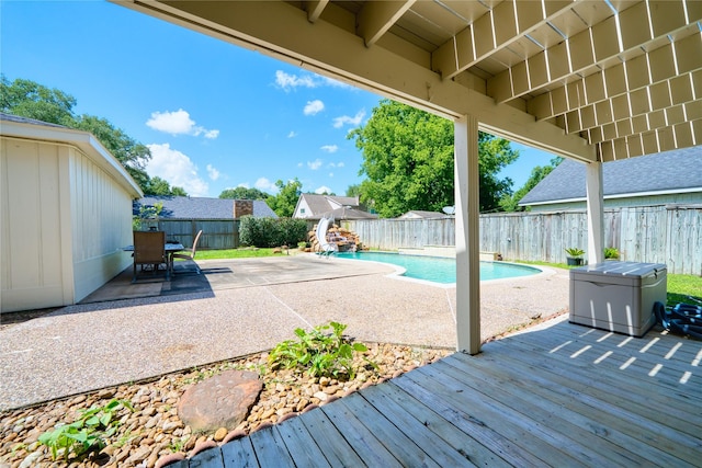 21434 Park Bluff Dr, Katy, TX 77450 - view of pool featuring a wooden deck, a fenced backyard, a patio, and outdoor dining area