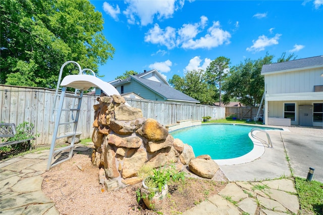 21434 Park Bluff Dr, Katy, TX 77450 - view of swimming pool featuring a patio, a fenced backyard, and a water slide