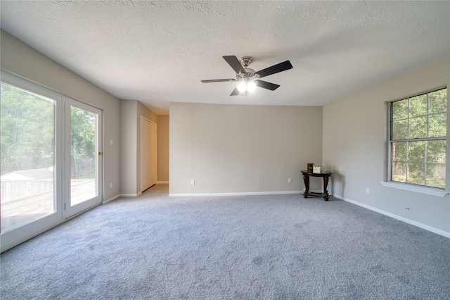 21434 Park Bluff Dr, Katy, TX 77450 - unfurnished room with a textured ceiling, light colored carpet, and ceiling fan