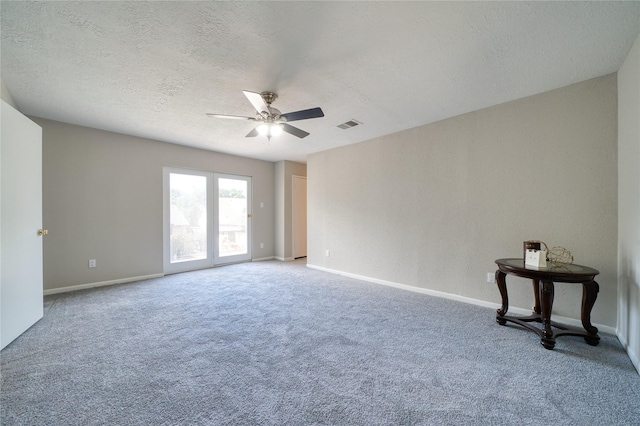 21434 Park Bluff Dr, Katy, TX 77450 - unfurnished room featuring ceiling fan, carpet floors, and a textured ceiling