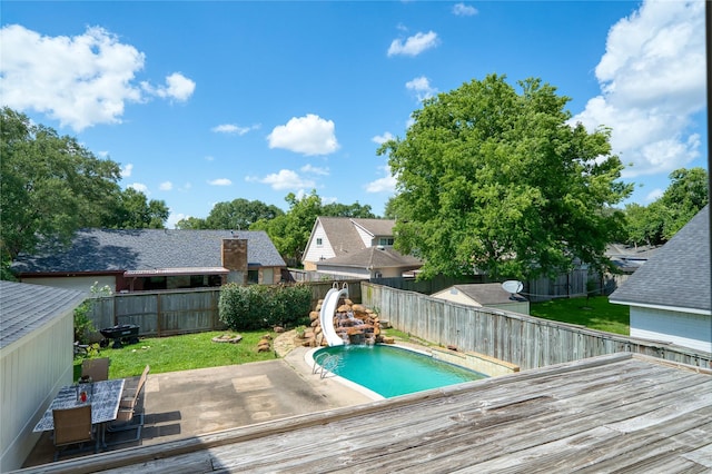 21434 Park Bluff Dr, Katy, TX 77450 - view of swimming pool with a water slide, a fenced backyard, a deck, and a patio