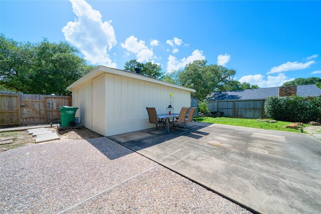 21434 Park Bluff Dr, Katy, TX 77450 - fenced backyard featuring a patio, a gate, and outdoor dining area