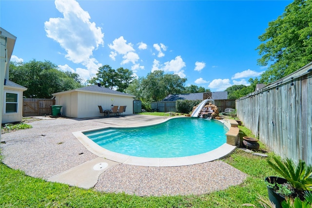 21434 Park Bluff Dr, Katy, TX 77450 - view of swimming pool featuring a water slide, a patio, and a fenced backyard