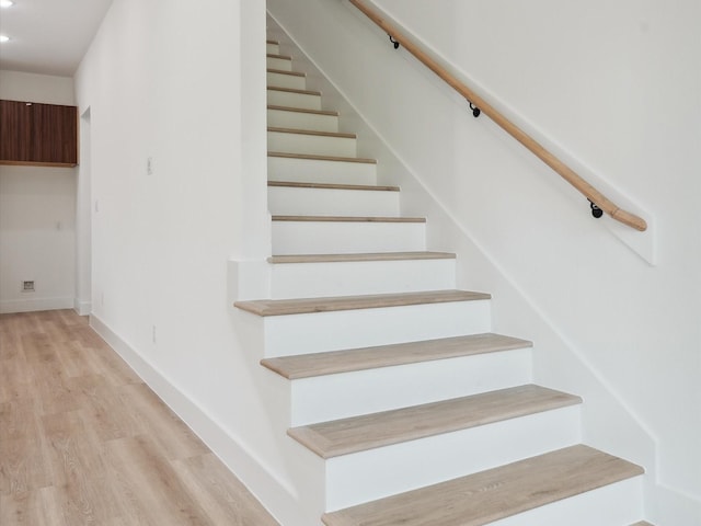 7420 Maxroy St, Houston, TX 77088 - stairway with wood finished floors and recessed lighting