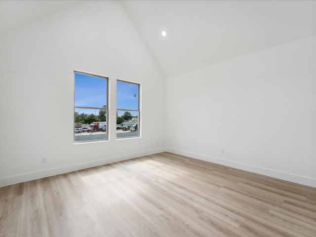 7420 Maxroy St, Houston, TX 77088 - spare room with light wood-style flooring, high vaulted ceiling, and recessed lighting