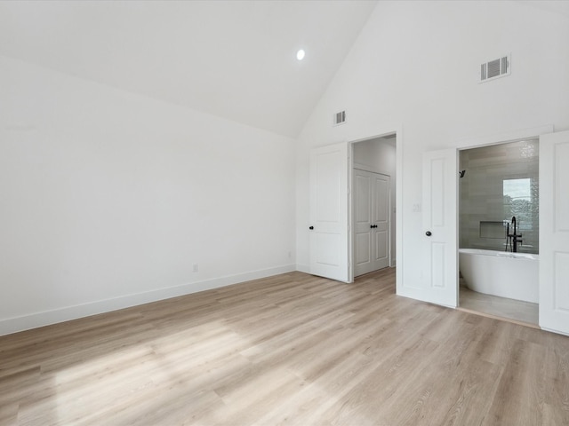 7420 Maxroy St, Houston, TX 77088 - unfurnished bedroom featuring high vaulted ceiling, light wood-type flooring, and recessed lighting