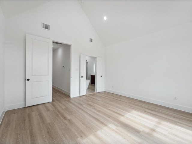 7420 Maxroy St, Houston, TX 77088 - unfurnished bedroom featuring high vaulted ceiling, light wood-style flooring, and recessed lighting