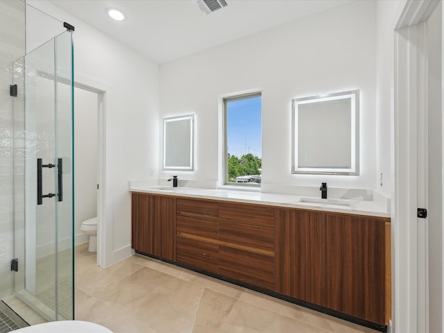 7420 Maxroy St, Houston, TX 77088 - bathroom with double vanity, a shower stall, and recessed lighting