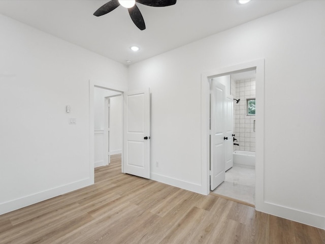 7420 Maxroy St, Houston, TX 77088 - unfurnished bedroom with light wood-style floors, ensuite bath, ceiling fan, and recessed lighting