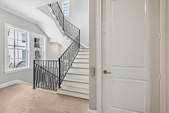 7515 Little Caprese Ln, Houston, TX 77055 - stairs with baseboards and wood finished floors