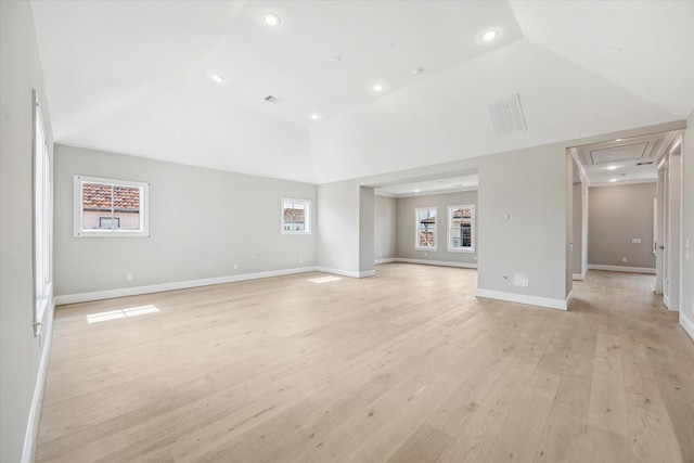 7515 Little Caprese Ln, Houston, TX 77055 - unfurnished living room with attic access, vaulted ceiling, recessed lighting, and light wood-style flooring