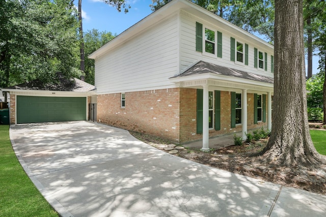 10813 Colony Wood Pl, The Woodlands, TX 77380 - view of property exterior featuring brick siding and a garage