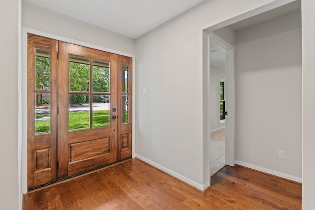 10813 Colony Wood Pl, The Woodlands, TX 77380 - entryway with hardwood / wood-style flooring and baseboards