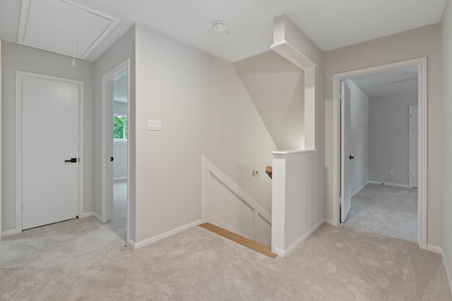10813 Colony Wood Pl, The Woodlands, TX 77380 - hall featuring attic access, carpet, and an upstairs landing