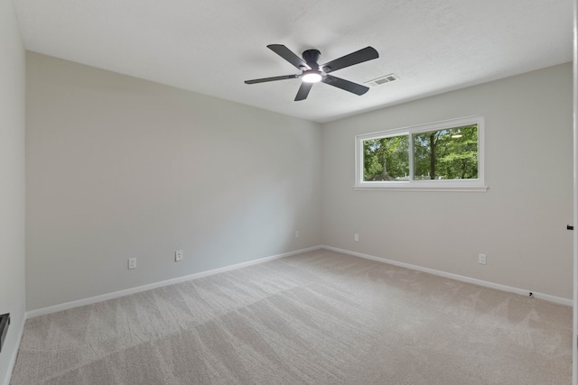 10813 Colony Wood Pl, The Woodlands, TX 77380 - empty room featuring light colored carpet and ceiling fan
