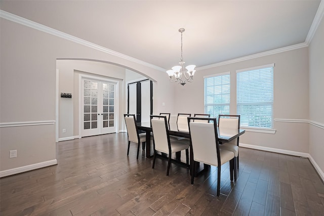 11810 White Flint Ln, Cypress, TX 77433 - dining room featuring arched walkways, french doors, a chandelier, crown molding, and dark wood-type flooring