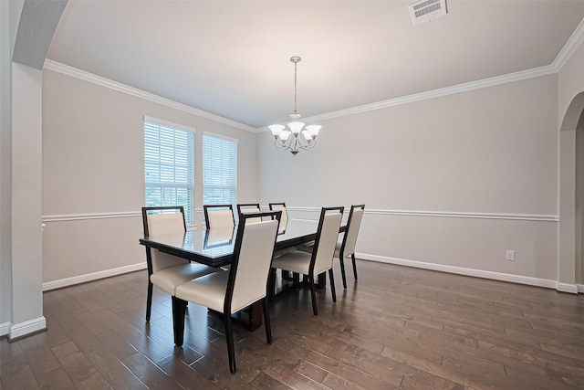 11810 White Flint Ln, Cypress, TX 77433 - dining area featuring ornamental molding, a chandelier, dark wood-style floors, and arched walkways