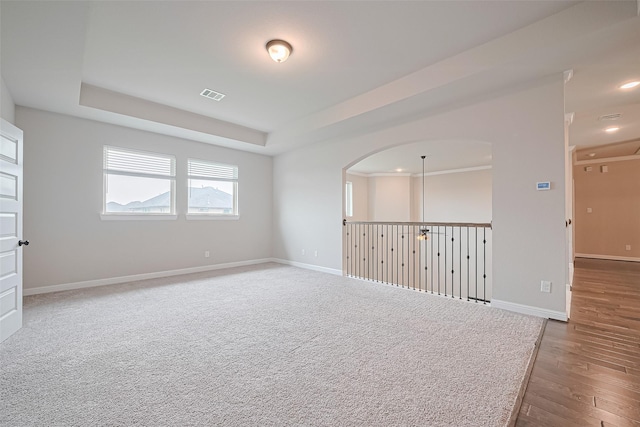 11810 White Flint Ln, Cypress, TX 77433 - empty room featuring wood finished floors, a tray ceiling, and recessed lighting
