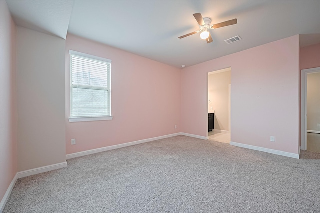 11810 White Flint Ln, Cypress, TX 77433 - unfurnished bedroom with light carpet, ensuite bath, and ceiling fan