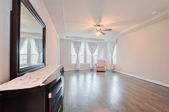 11810 White Flint Ln, Cypress, TX 77433 - living area with ceiling fan, dark wood-style flooring, and a raised ceiling
