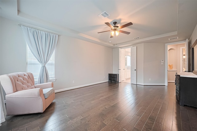 11810 White Flint Ln, Cypress, TX 77433 - sitting room featuring a raised ceiling, dark wood finished floors, and a ceiling fan