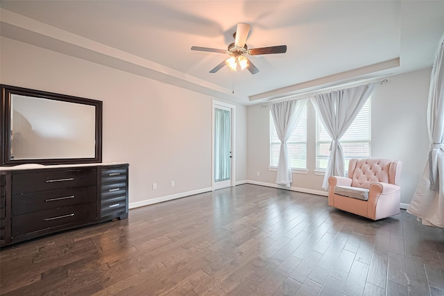11810 White Flint Ln, Cypress, TX 77433 - unfurnished room with a raised ceiling, ceiling fan, and dark wood finished floors