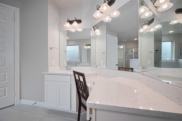 11810 White Flint Ln, Cypress, TX 77433 - bathroom with a stall shower, vanity, plenty of natural light, and tile patterned flooring