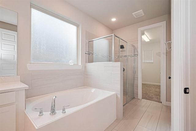 11810 White Flint Ln, Cypress, TX 77433 - bathroom with a garden tub, a stall shower, and vanity
