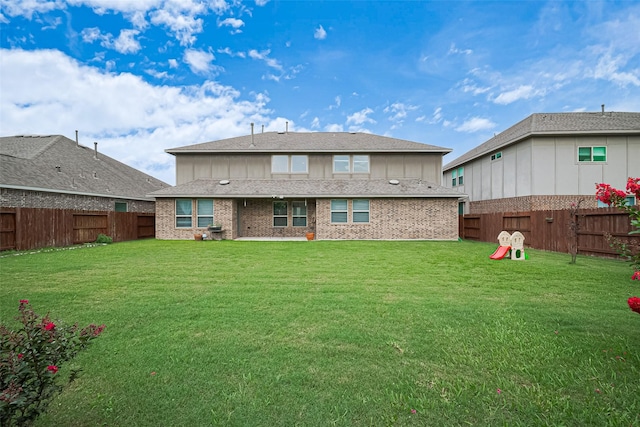 11810 White Flint Ln, Cypress, TX 77433 - rear view of property featuring a fenced backyard, board and batten siding, and brick siding