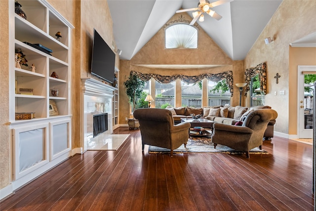 7914 Chianti Ct, Sugar Land, TX 77479 - living area featuring a fireplace, ceiling fan, wood-type flooring, and high vaulted ceiling