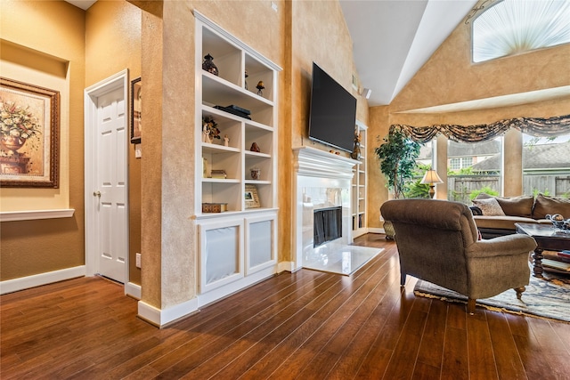 7914 Chianti Ct, Sugar Land, TX 77479 - living room with a fireplace, high vaulted ceiling, hardwood / wood-style flooring, and a textured wall