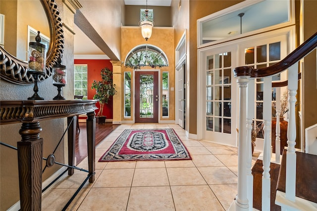 7914 Chianti Ct, Sugar Land, TX 77479 - foyer entrance featuring a high ceiling, tile patterned floors, and a chandelier