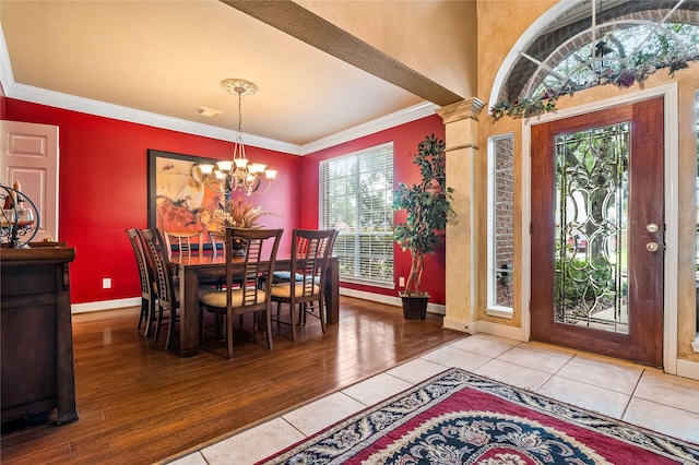 7914 Chianti Ct, Sugar Land, TX 77479 - tiled dining area featuring a chandelier and crown molding