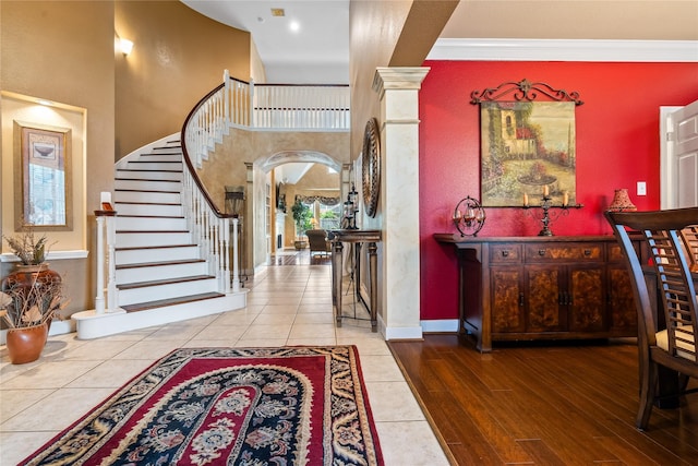 7914 Chianti Ct, Sugar Land, TX 77479 - tiled foyer featuring stairs, crown molding, and a high ceiling