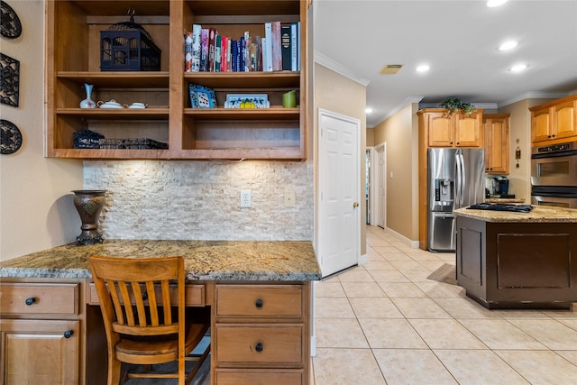 7914 Chianti Ct, Sugar Land, TX 77479 - kitchen with appliances with stainless steel finishes, ornamental molding, backsplash, built in desk, and recessed lighting