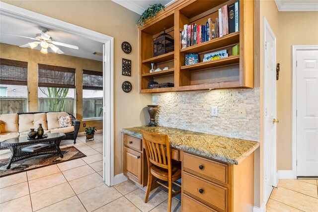 7914 Chianti Ct, Sugar Land, TX 77479 - office space with built in desk, light tile patterned flooring, ornamental molding, and a ceiling fan