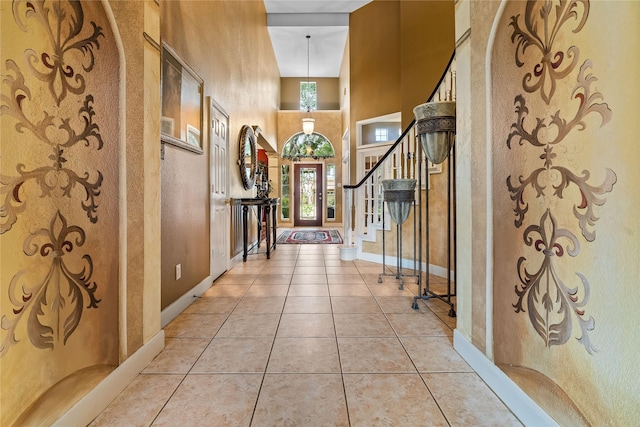 7914 Chianti Ct, Sugar Land, TX 77479 - hallway with stairs, a towering ceiling, and tile patterned flooring