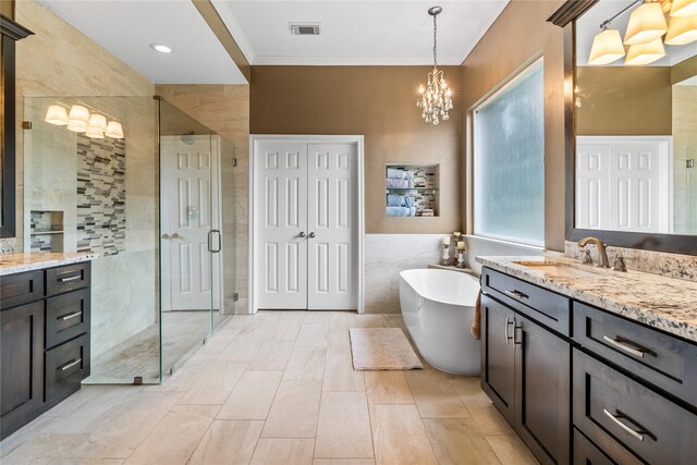 7914 Chianti Ct, Sugar Land, TX 77479 - bathroom featuring vanity, a stall shower, crown molding, a freestanding bath, and a chandelier