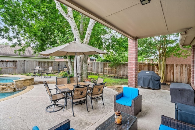7914 Chianti Ct, Sugar Land, TX 77479 - fenced backyard featuring area for grilling, outdoor dining space, an in-ground hot tub, and a patio area