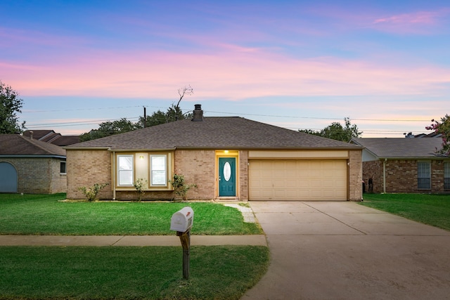 735 Red Rock Canyon Dr, Katy, TX 77450 - ranch-style house with driveway, a front lawn, an attached garage, and brick siding