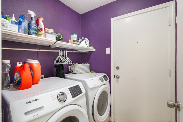 735 Red Rock Canyon Dr, Katy, TX 77450 - laundry area featuring washer and clothes dryer, a textured ceiling, and a textured wall